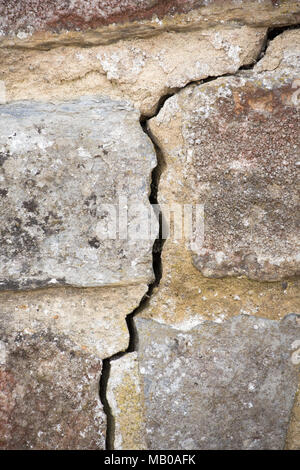A crack in a stone wall, UK Stock Photo