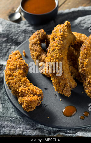 Homemade Deep Fried Ribs with Barbecue Sauce Stock Photo