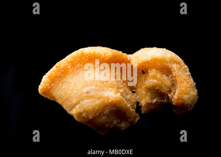 A pork scratching from a packet bought in a supermarket. UK Stock Photo