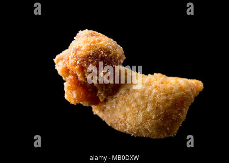 A pork scratching from a packet bought in a supermarket. UK Stock Photo