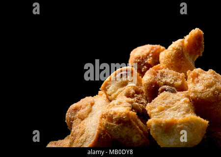 Pork scratchings from a packet bought in a supermarket. UK Stock Photo