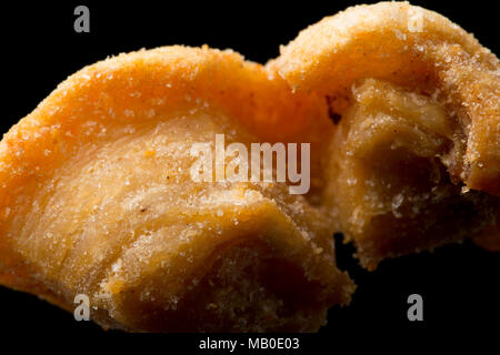 A pork scratching from a packet bought in a supermarket. UK Stock Photo