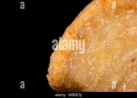 A pork scratching from a packet bought in a supermarket. UK Stock Photo