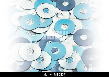 Random arrangement of silver blue DVD and CD disks create data concept background Stock Photo