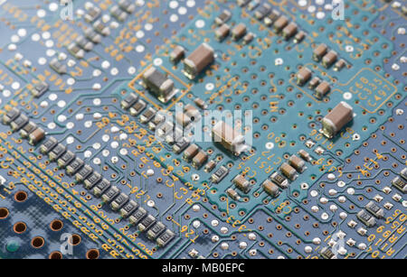 Details of a computer electronic circuit board with components transferring data. Concept of computer technology Stock Photo