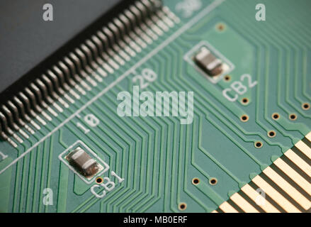 Details of a digital electronic circuit board with electric tracks and components. Concept of technology Stock Photo