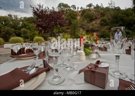 Close up view of a table set up for an outdoor wedding reception Stock Photo