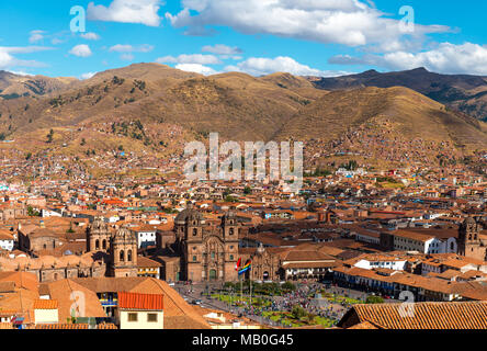 The urban skyline of Cusco city during daytime with the Plaza de Armas and cathedral and the Andes mountain range in the background, Peru. Stock Photo