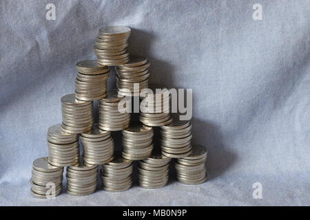 pyramid of coin stacking Stock Photo - Alamy