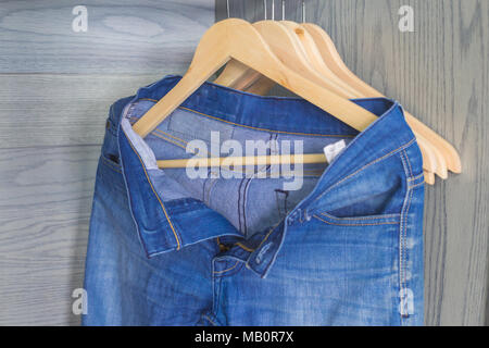 Blue jeans on a hanger Stock Photo