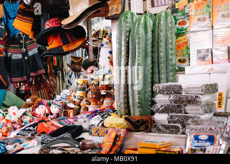 San Pedro cactus and souvenirs in the San Pedro Market in Cusco, Peru. Stock Photo