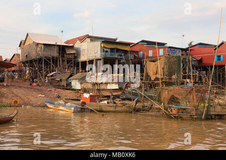 Boats moored by houses on stilts in a stilt village, Kampong Khleang, Tonle Sap inland lake,  Cambodia, Asia Stock Photo