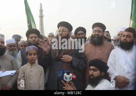 Head of Tehreek Sirat-e-Mustaqeem and his faction of Tehreek Labbaik Ya Rasool Allah (TLYRA) Dr. Ashraf Asif Jalali addressing to media persons at Greater Iqbal Park against the denial of permission by the authorities to organize “Nizam-e-Mustafa Conference” on Saturday in Lahore on April 05, 2018. Tehreek-e-Labaik Pakistan (TLP) is an Islamic political party in Pakistan. The movement was founded Dr. Ashraf Asif Jalali.The political party is known for widespread (often countrywide) street power and massive protests in opposition to any change in the blasphemy law of Pakistan. It came into exis Stock Photo