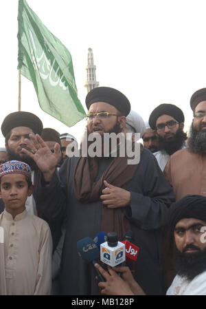 Head of Tehreek Sirat-e-Mustaqeem and his faction of Tehreek Labbaik Ya Rasool Allah (TLYRA) Dr. Ashraf Asif Jalali addressing to media persons at Greater Iqbal Park against the denial of permission by the authorities to organize “Nizam-e-Mustafa Conference” on Saturday in Lahore on April 05, 2018. Tehreek-e-Labaik Pakistan (TLP) is an Islamic political party in Pakistan. The movement was founded Dr. Ashraf Asif Jalali.The political party is known for widespread (often countrywide) street power and massive protests in opposition to any change in the blasphemy law of Pakistan. It came into exis Stock Photo