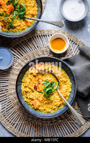 Red lentil and pumpkin soup with turmeric and coconut milk Stock Photo