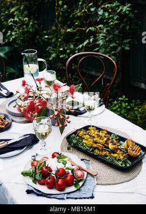 summer picnic: mediterranean salad, turmeric chicken skewers. Stock Photo