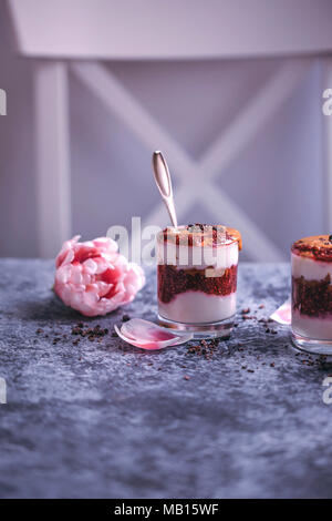 Peanut butter and raspberry chia jam parfait desserts served in glasses Stock Photo