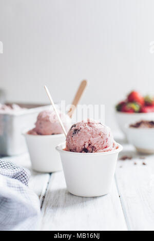 Strawberry ice cream in white cups Stock Photo