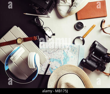 Overhead view of travel outfit and accessories. Tourism concept background. Vintage toned image. Top view. Flat lay.
