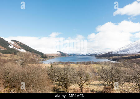 Loch Earn landscape after an early spring snowfall, with Lochearnhead village at the western end - view from the Rob Roy Way footpath, Scotland, UK Stock Photo