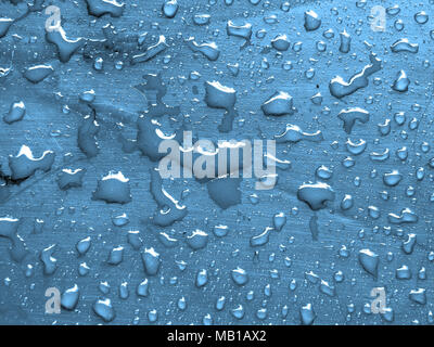 water drops on maya blue metallic surface Stock Photo