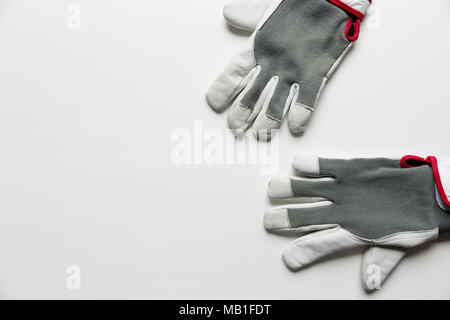 Working men's construction gloves isolated on white background Stock Photo