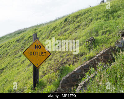 No outlet sign with stone stairs leading up to the right outdoors Stock Photo