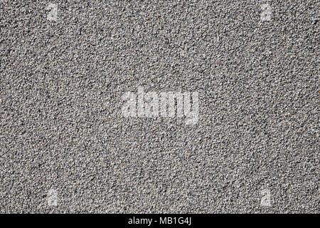 Grey wall made of very small pebble evenly spread around it Stock Photo