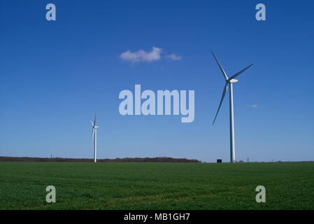The Wind Turbines on farmland near Clacton on Sea Essex are the largest land wind turbines in the UK. Stock Photo