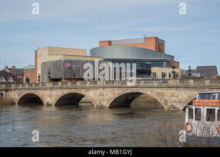 The river Severn is very high next to the Shrewsbury theatre severn on this warm sunny spring afternoon in the west midlands town of Shropshire