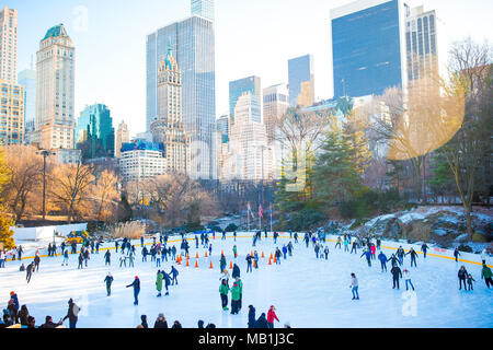 Ice skaters having fun in New York Central Park in winter Stock Photo