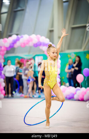 Little gymnast participates in competitions in rhythmic gymnastics ...