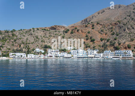 View of village and harbour from sea, Loutro, Sfakia, Chania Region, Crete (Kriti), Greece Stock Photo