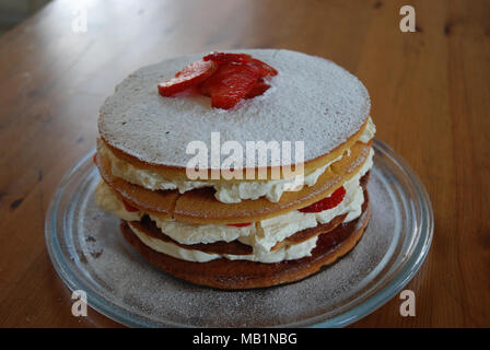 1st attempt at making a 3 tiered strawberry and cream victoria sponge cake with homemade jam Stock Photo