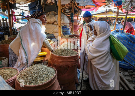 Bahir Dar, Amhara Region, Ethiopia - January 20, 2018: Unidentified woman selling coffee beans at the market in Bahir Dar, Ethiopia. Stock Photo