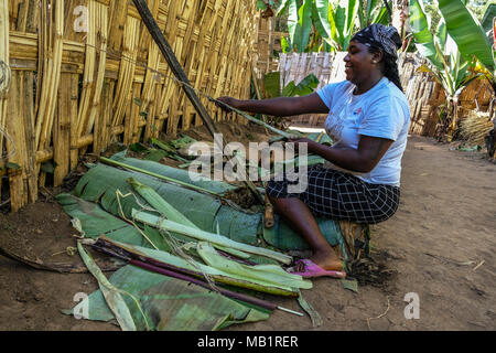 Chencha, Ethiopia, January 22, 2018: African woman of the Dorze ethnic group is preparing the injera, local bread, at the Chencha village in Ethiopia. Stock Photo