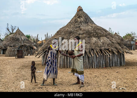 Omo Valley, Ethiopia - January 26, 2018: Two unidentified women of the Karo tribe speaking in their village in Omo valley, Ethiopia. Stock Photo