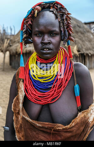 Omo Valley, Ethiopia - January 26, 2018: Unidentified Karo woman with traditional jewelry in her village in Omo Valley, Ethiopia. Stock Photo