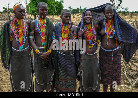 Omo Valley, Ethiopia, January 26, 2018: Unidentified women from Arbore tribe pose for a portrait with traditional jewelry in their village. Stock Photo