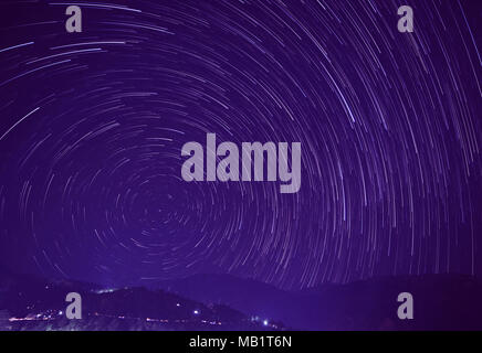 star trails above Himalayan mountains in India, Dharamsala Stock Photo