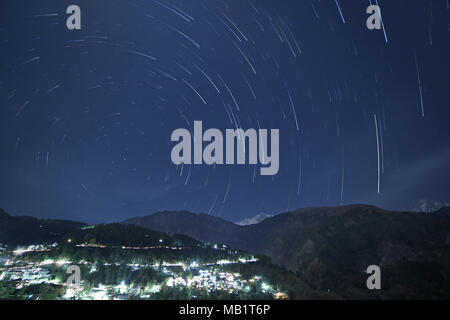 star trails above Himalayan mountains in Dharamsala, India Stock Photo