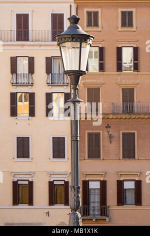 A street lamp on the Spanish steps in Piazza di Spagna, Rome, Italy. The colours of the background buildings made me think of the choice between White Stock Photo