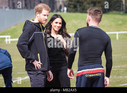 Bath, UK. 6th April, 2018. Prince Harry introduces Meghan Markle to Former Royal Marine Andy Grant who won two gold medals at the 2014 Invictus Games  The couple were attending the Invictus Games Trials held at Bath University Credit: David Betteridge/Alamy Live News Stock Photo