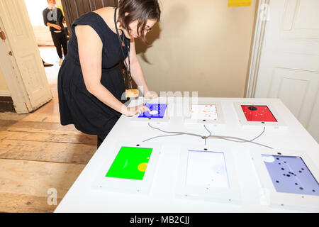 Somerset House, London, 6th April 2018. The 'I create, you destroy' game with visual displays.Visitors, particularly children, enjoy interacting with the games. Now Play This is an interactive exhibition and festival of game design and opens today at Somerset House in Central London. Credit: Imageplotter News and Sports/Alamy Live News Stock Photo