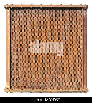 Rusty radiator of a vintage agricultural tractor with a thousand round holes. Isolated on white outdoor sunny spring day shot Stock Photo