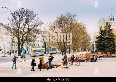 Gomel, Belarus - April 15, 2010: People Walking And Taking Photo Near Clown Statue In Sovetskaya Street In Sunny Spring Day. Stock Photo