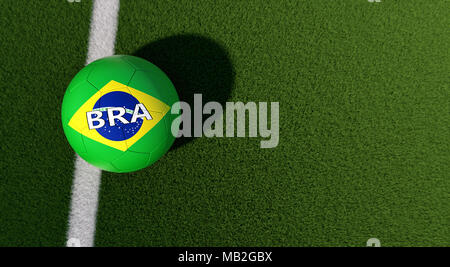 Soccer ball in brazils national colors on a soccer field. Copy space on the right side - 3D Rendering Stock Photo