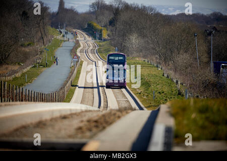 Purple, Bus Rapid Transit scheme in Greater Manchester,  Volvo B5LH hybrid double-decker on the guided busway Tyldesley Loopline old railway line Stock Photo