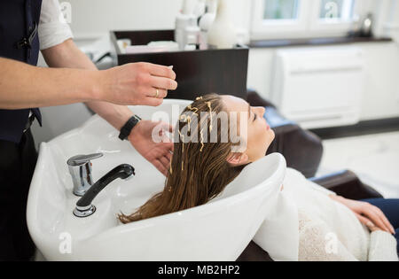 Girl Applying Hair Conditioner. Woman Touching Her Hair With Balm 