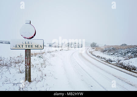 Coast road at Cley covered in snow February 2018, North Norfolk Stock Photo